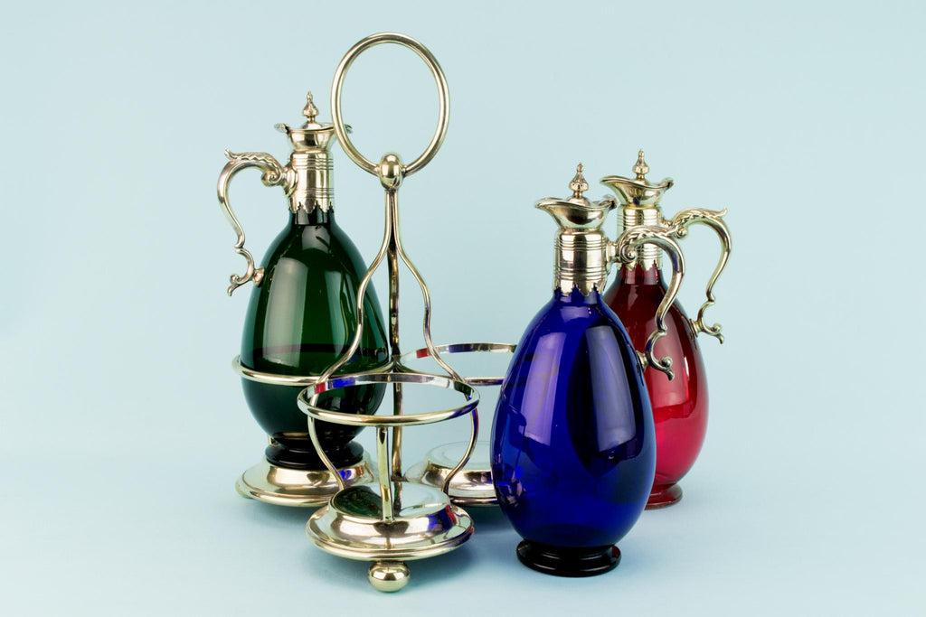 Three Colourful Decanters Set on a Stand, English 19th Century