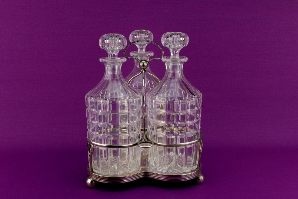 3 Glass decanters on stand, English Early 1900s
