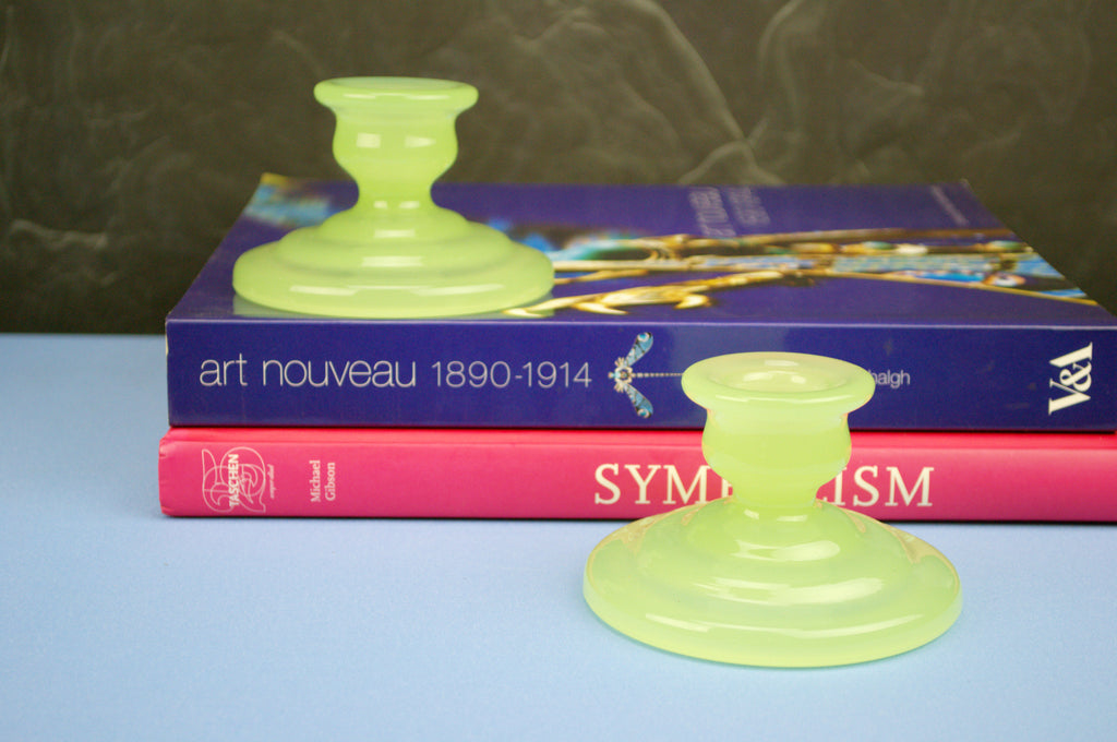 2 green glass candlesticks